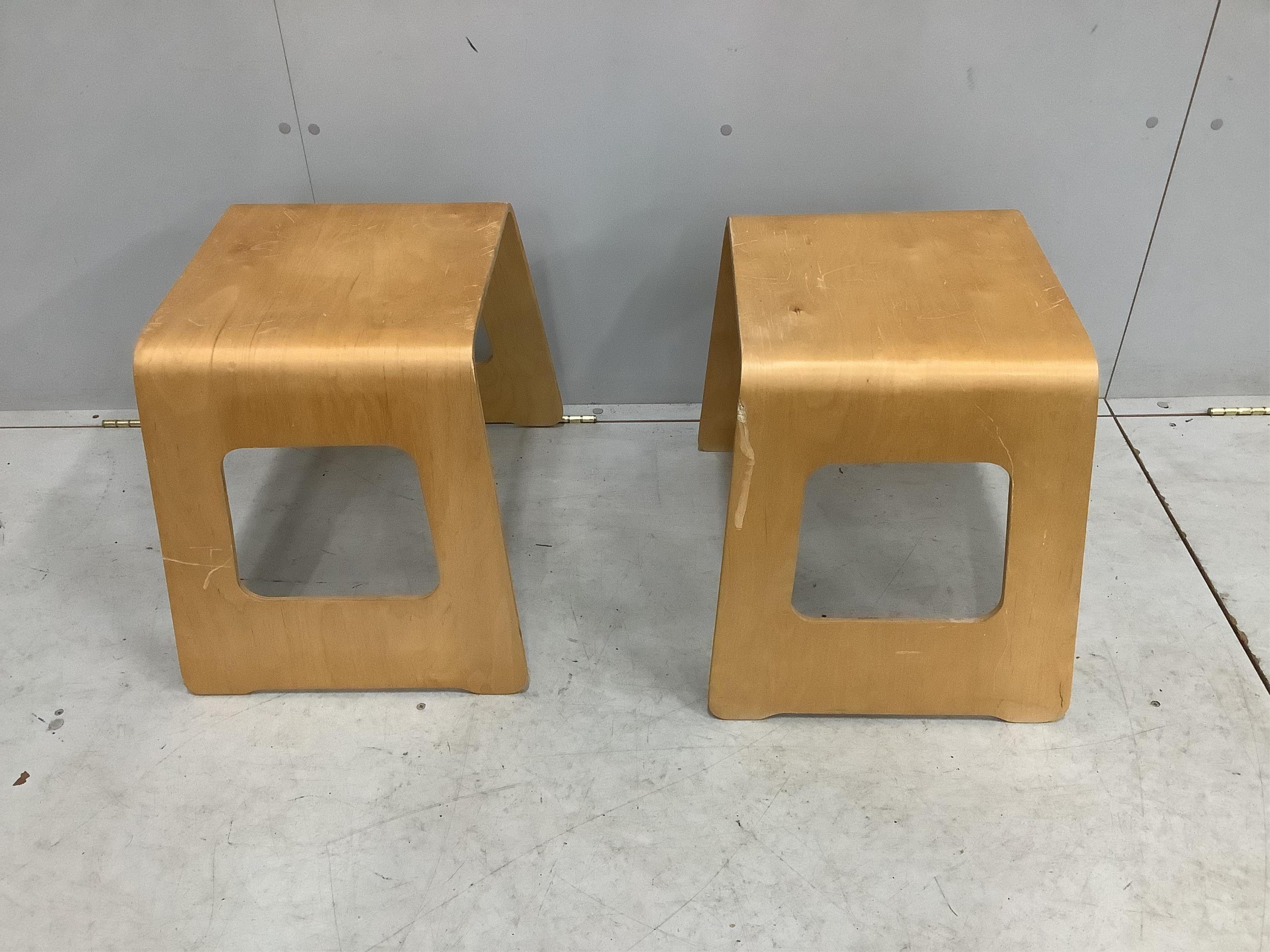 A pair of Swedish wooden stools by USA Norinder for IKEA, c.1990, each width 48cm, depth 35cm, height 44cm. Condition - fair